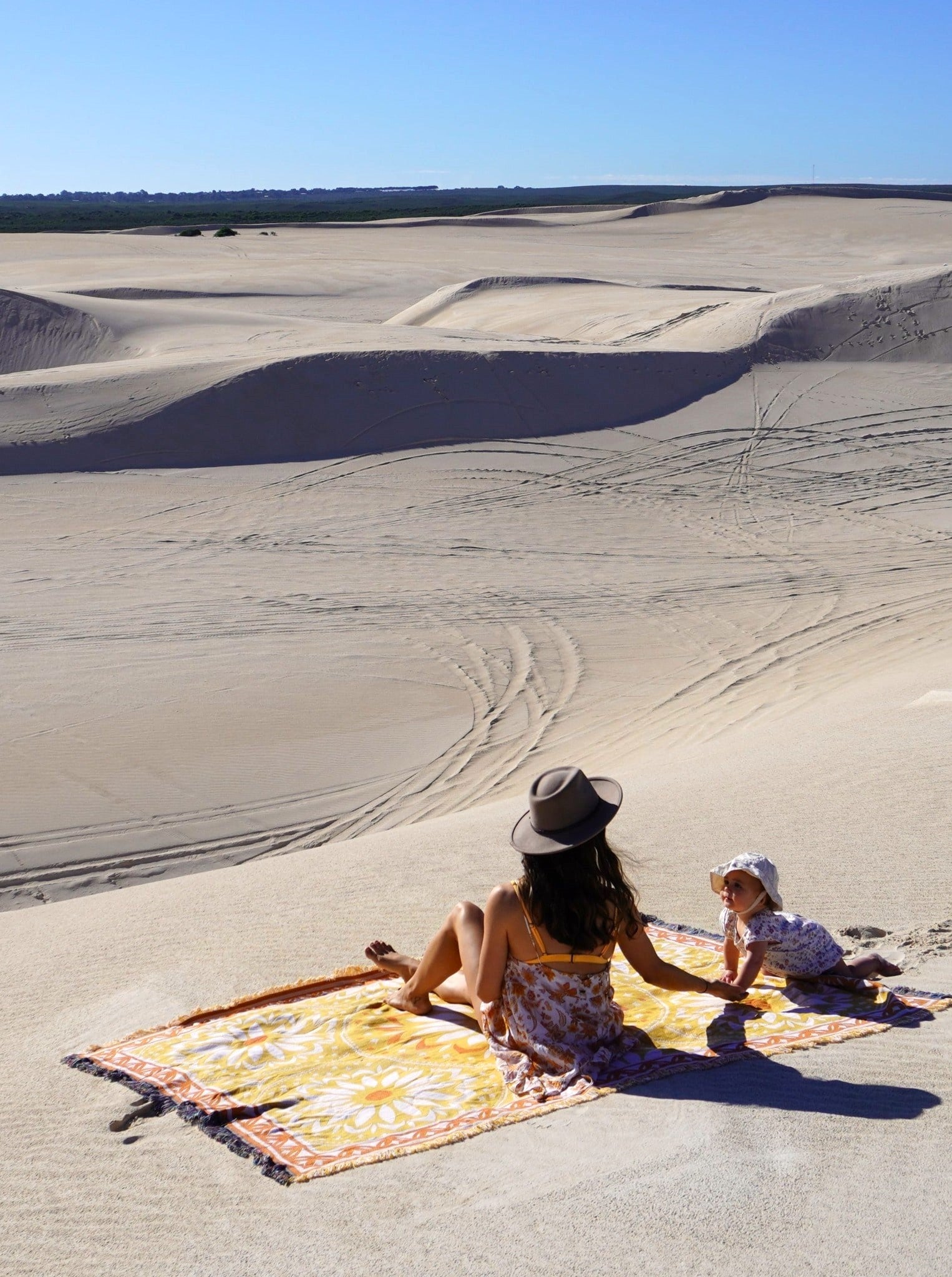 Mum and child van life adventures. Australia sand plains. Better Days throw rug yellow, perfect for self-care and travel. XL size to fit over queen bed or family picnic