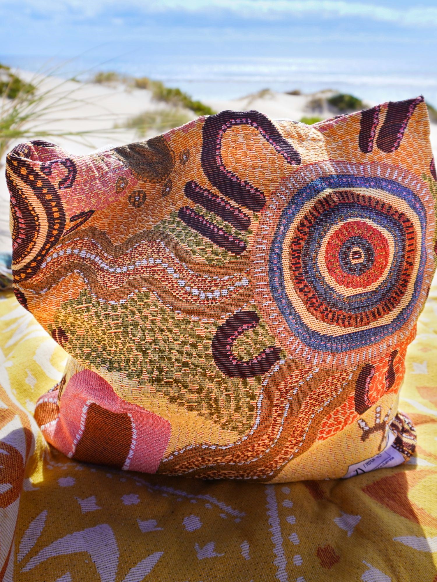 Coming Home Indigenous art tote bag. Woven from recycled fabrics. First Nations art, designed in Aus.