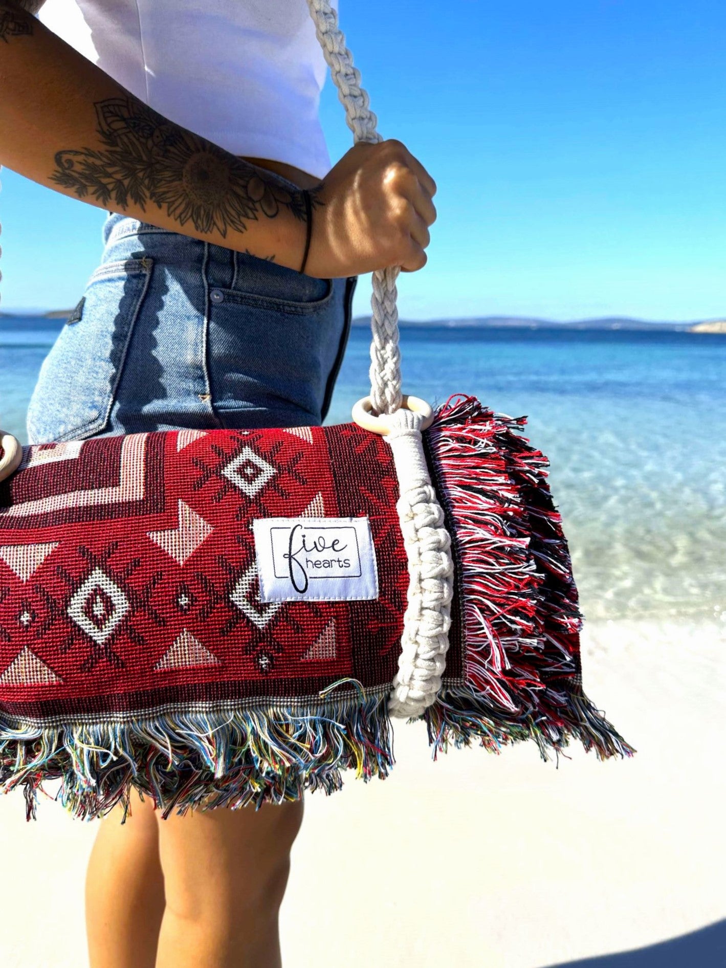 Love Lost Throw Beach Blanket with Macramé carry strap on white sandy beach Western Australia