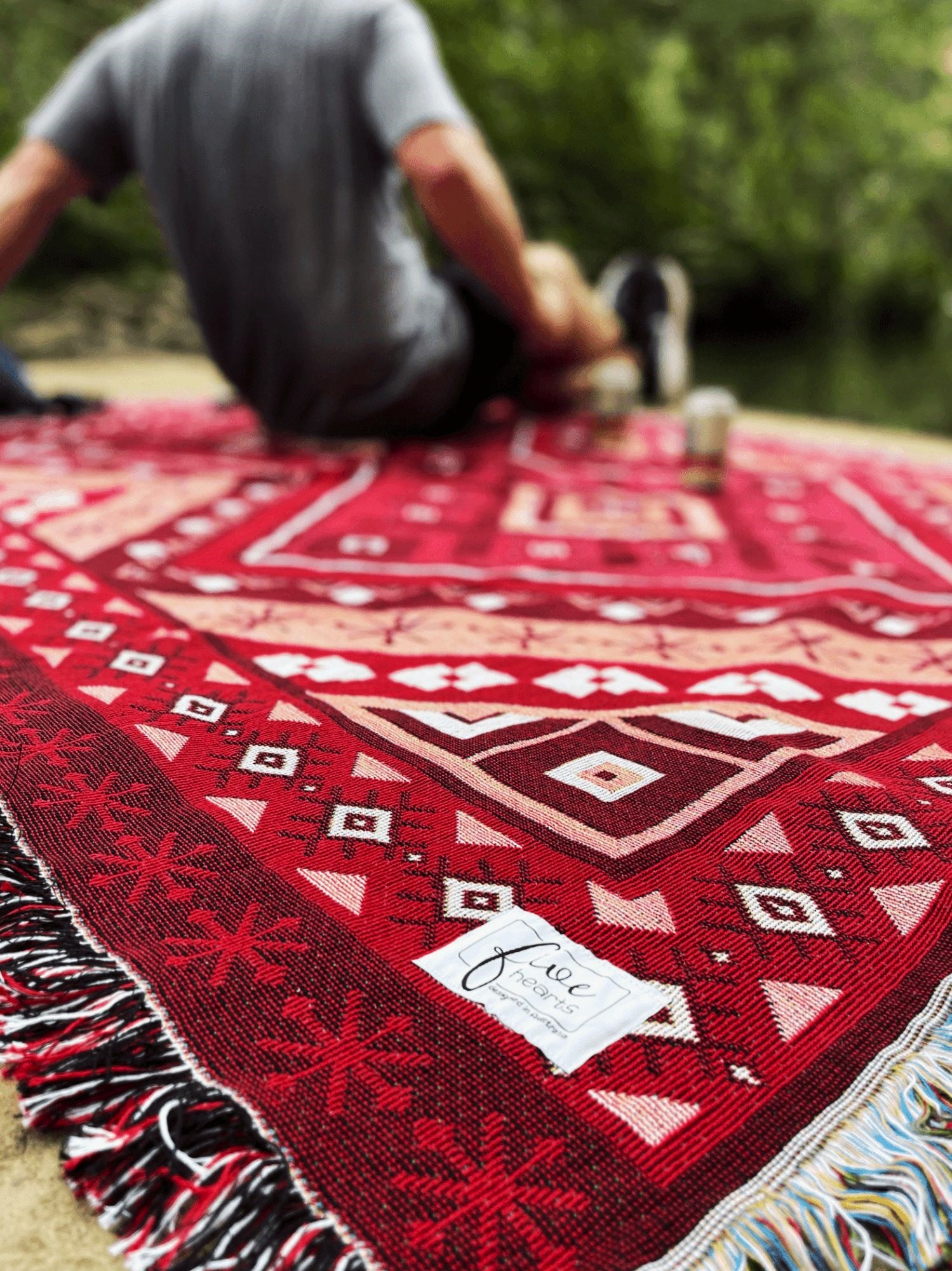 Red beach blanket / throw rug on camping trip beers outdoors reset