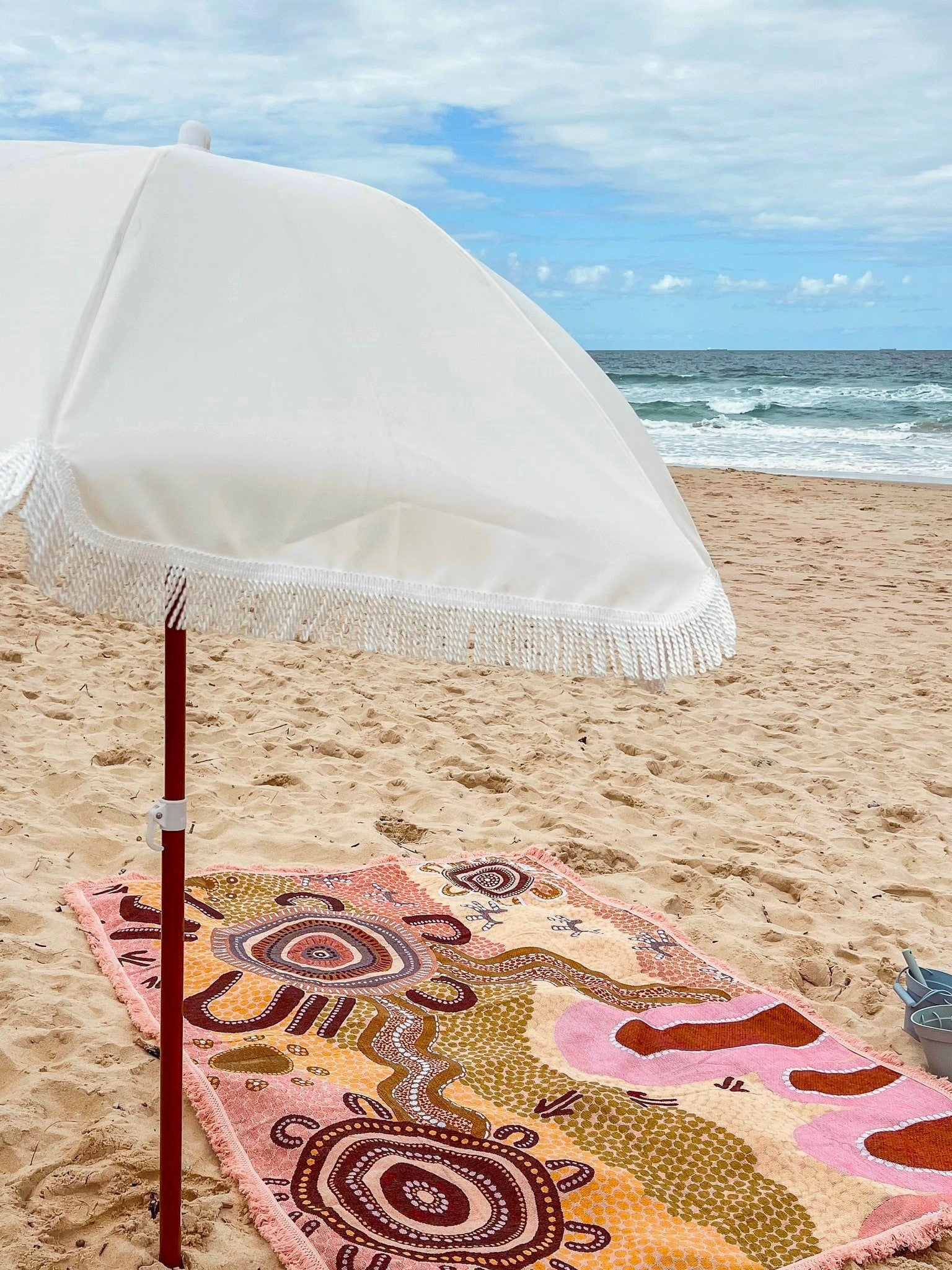 Coming Home Indigenous First Nations art throw rug beach blanket umbrella. Quality time, self-care reset.  Woven from recycled fabrics. First Nations art, Kalkadoon designed in Australia