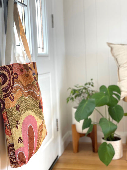 Coming Home Indigenous art tote bag. Woven from recycled fabrics. First Nations art, designed in Aus.