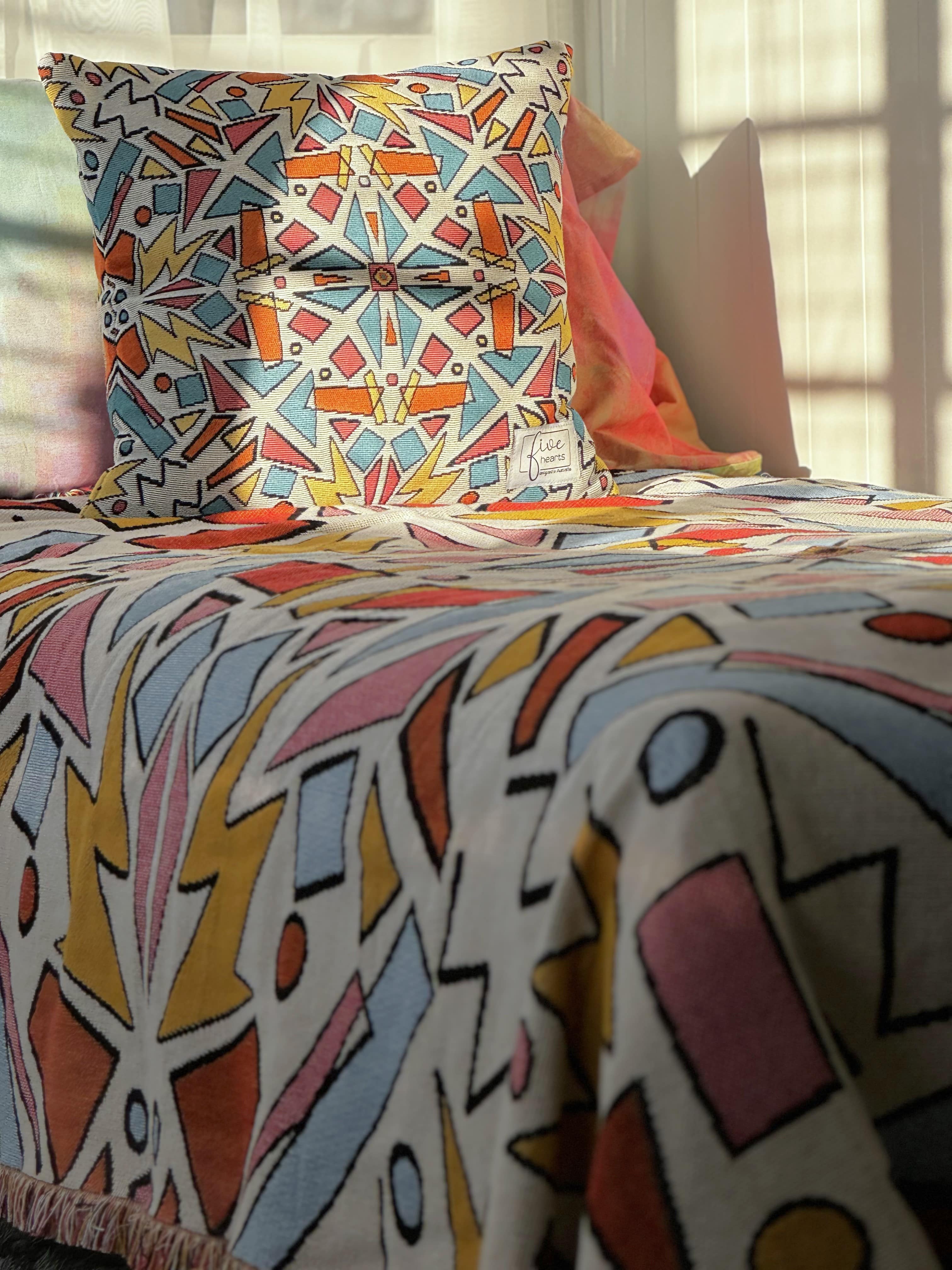 Just Ace cushion and throw blanket bedspread 90s vibe colourful design. Designed in Australia. 90s bedroom decor ideas. Millennials nostalgic colourful bold playful